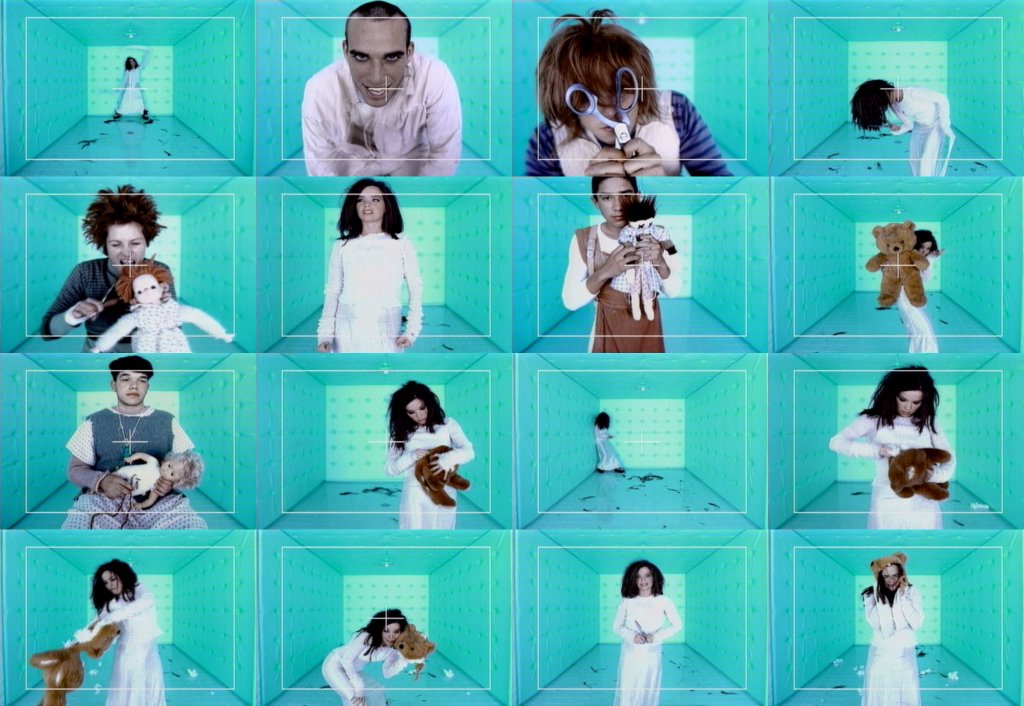 Violently Happy (1994)The video seemingly takes place in a padded room of a mental institute. Björk is portrayed singing the song in a white dress resembling an open straitjacket with pieces of hair surrounding her; plus, a Norman Reedus cameo as her inmate