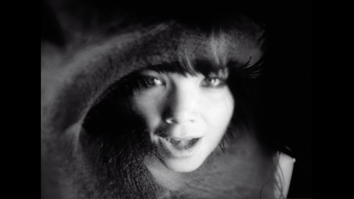 Isobel (1995)The B&W video portrays various surreal scenes, including a long-haired Björk playing a water-fueled piano. Another scene shows various airplanes being formed inside light bulbs which sprouts from the ground, and the end features Björk juxtaposed with a waterfall.