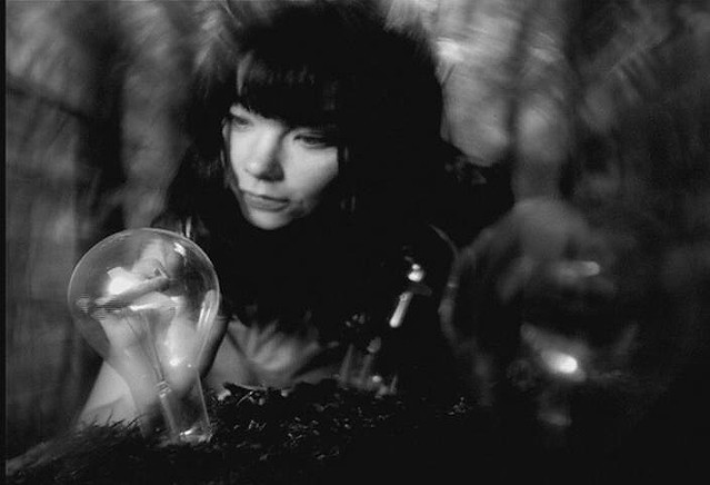 Isobel (1995)The B&W video portrays various surreal scenes, including a long-haired Björk playing a water-fueled piano. Another scene shows various airplanes being formed inside light bulbs which sprouts from the ground, and the end features Björk juxtaposed with a waterfall.