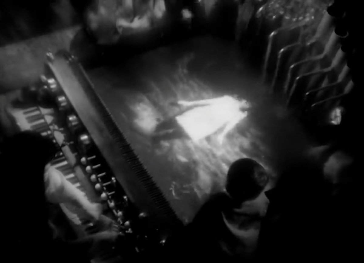 Isobel (1995)The B&W video portrays various surreal scenes, including a long-haired Björk playing a water-fueled piano. Another scene shows various airplanes being formed inside light bulbs which sprouts from the ground, and the end features Björk juxtaposed with a waterfall.