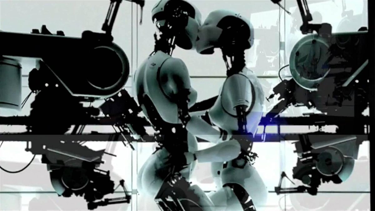 It smiles and extends its hand to the sitting robot, joining in the song. The robots passionately kiss and embrace while the machines assemble their backs and light comes and goes. The video won the MTV Video Music Award for Best Visual Effects and for Breakthrough Video