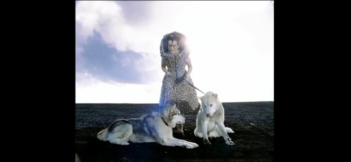 Who Is It (2004)In the video, Björk wears a dress made of bells, by Alexander McQueen, and perform the song while accompanied by a group of children, also wearing outfits adorned with bells.