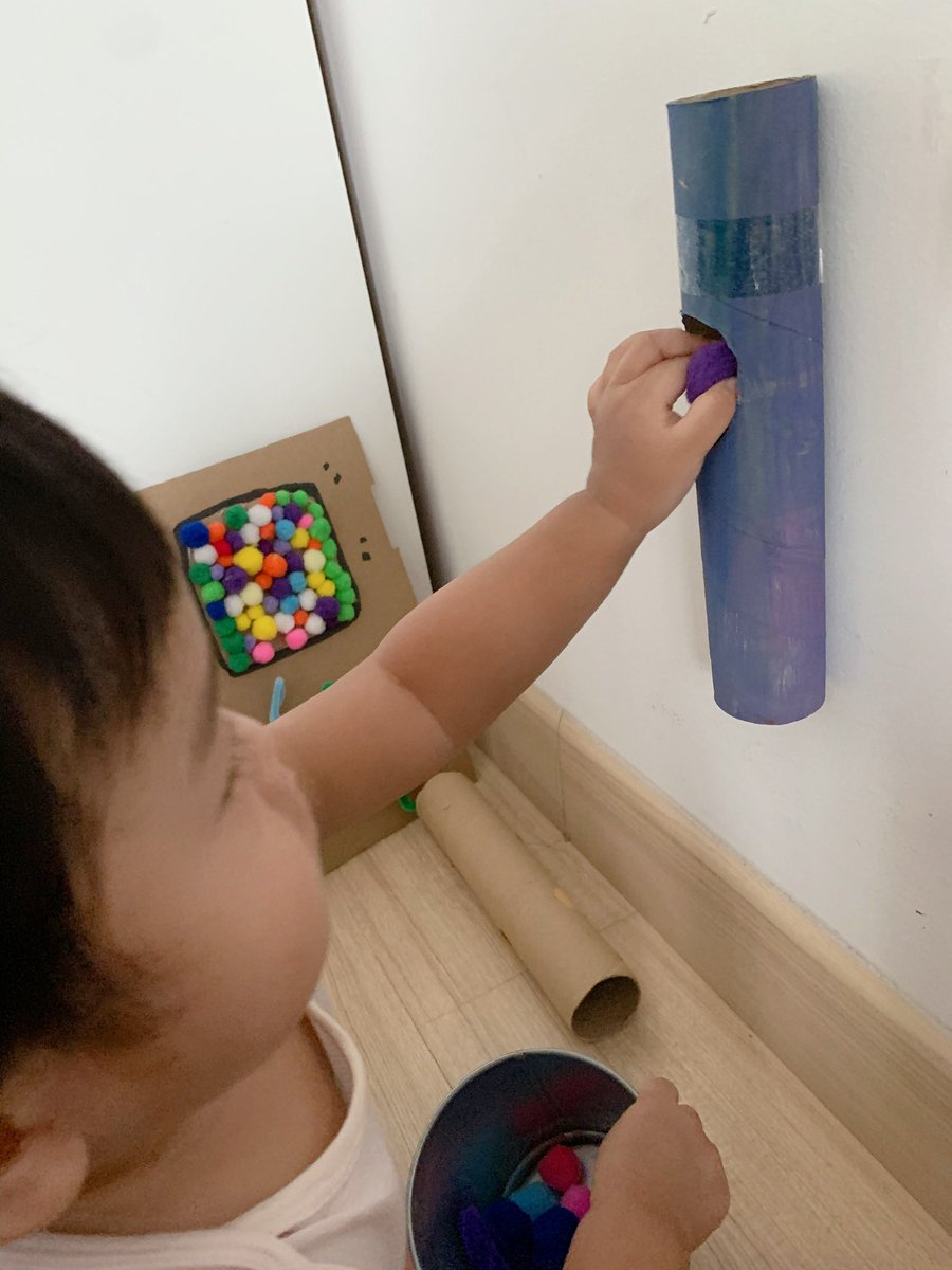 Drop activity using pom pom balls and paper roll. It’s great for helping him develop fine motor skills and an understanding of cause and effect.Pom pom balls can be replaced with something else. Sometimes I used markers.