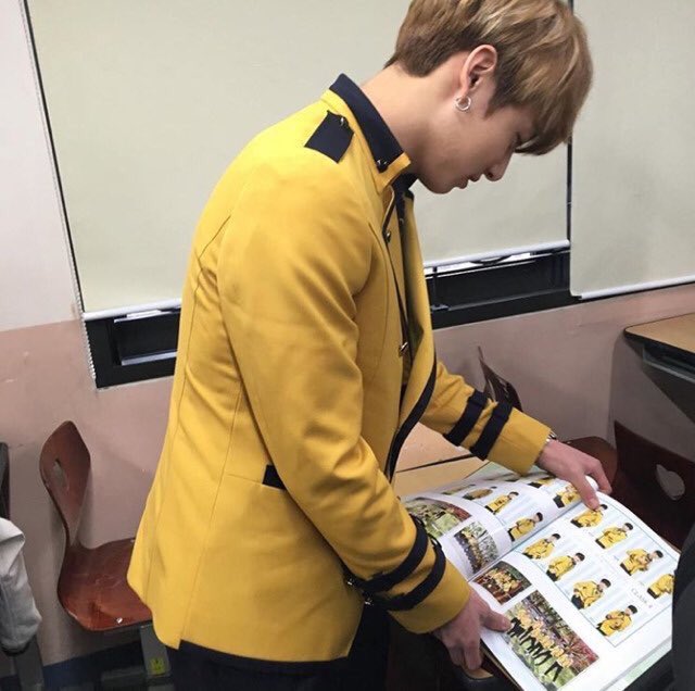 Jungkook looking at his year book