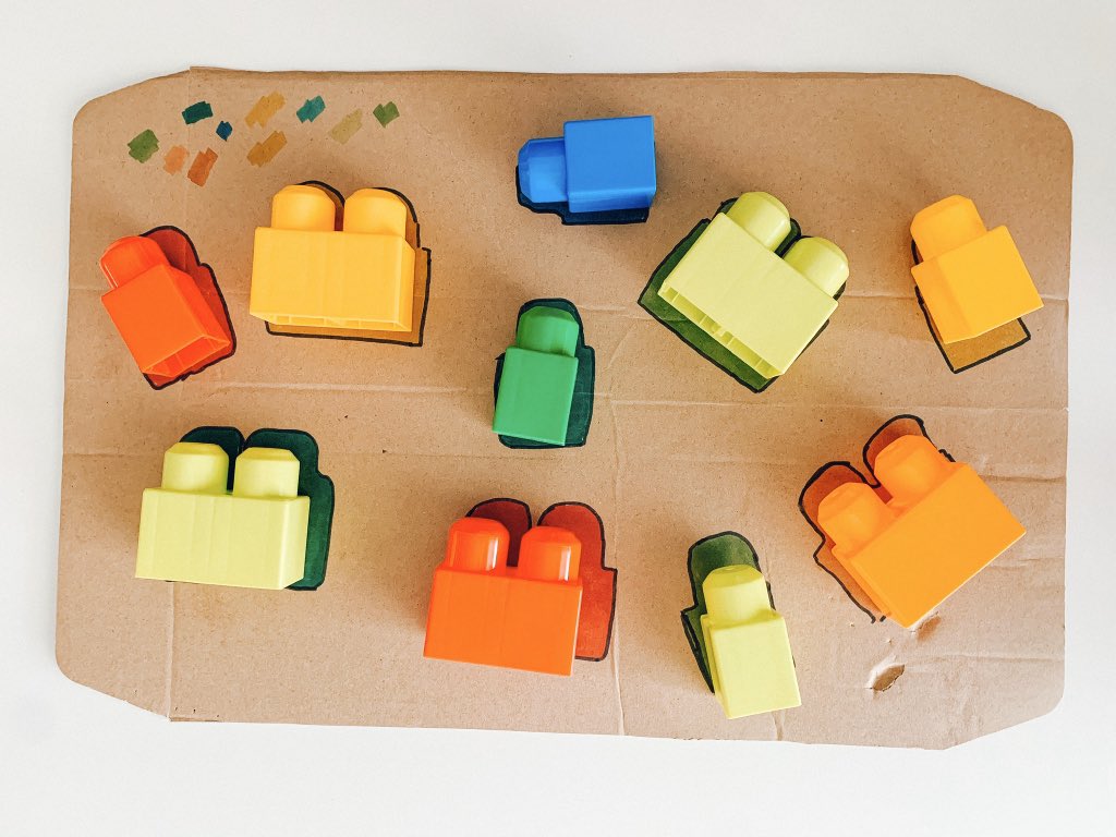 Here’s a simple colour matching activity that you might like to set up and try with your kid. It involves them focusing on colours of objects and matching them together.I’m using cardboard and lego.