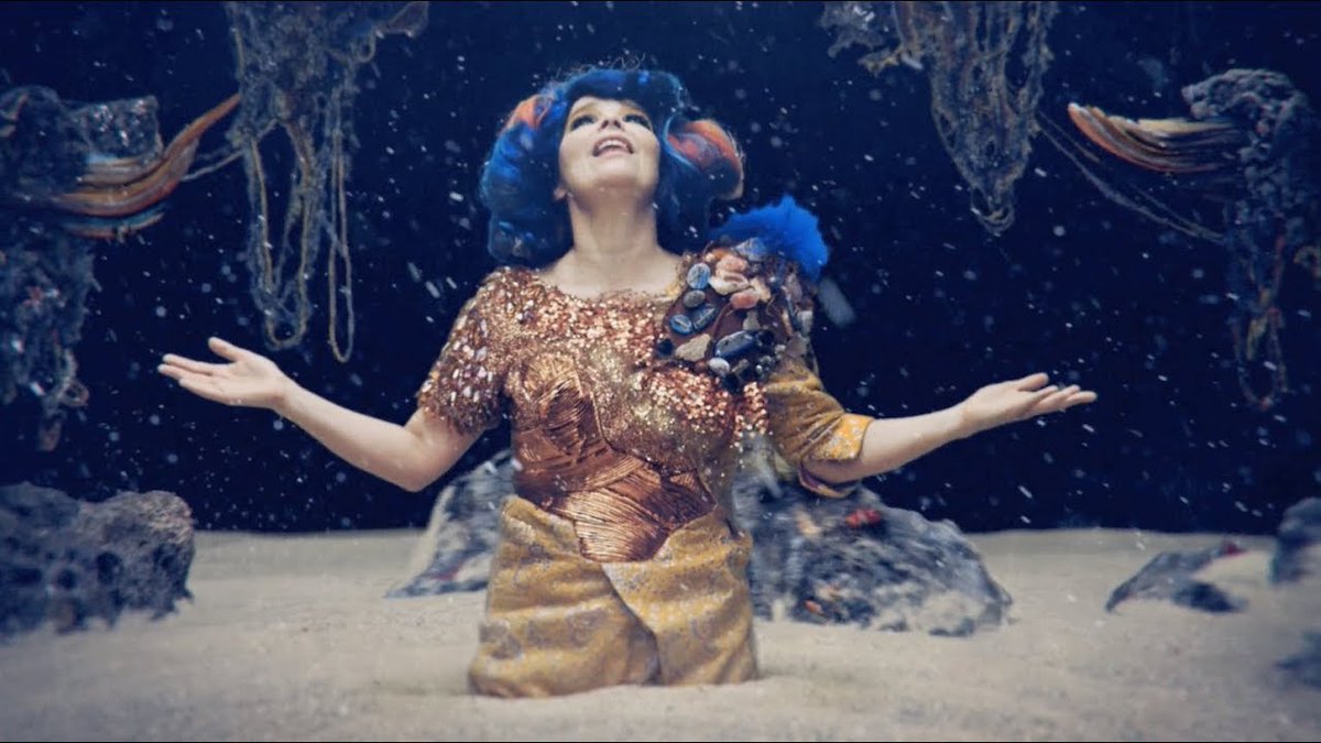 Mutual Core (2012)Commissioned and premiered at the MOCA in Los Angeles, portrays Björk in a sand bed, while various rocks revolve around her. At the end of the video, two rocks unite to form a volcano, which shapes resemble Björk's face features