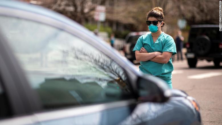 CNN's tweet photo. A small group of health care workers counterprotested at a large rally in Colorado demanding the state reopen and ease the restrictions designed to slow the spread of the coronavirus pandemic. https://t.co/TUnIYbsFsG https://t.co/m8Grl9NmCv