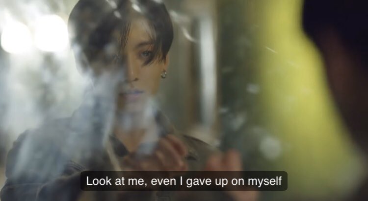 A recurring theme in a lot of the videos is that Jungkook is always trying to keep his friends together/be with them until they reunite. In Fake Love he’s separated from all of them again but watching closely. For RM it’s through the mirror: