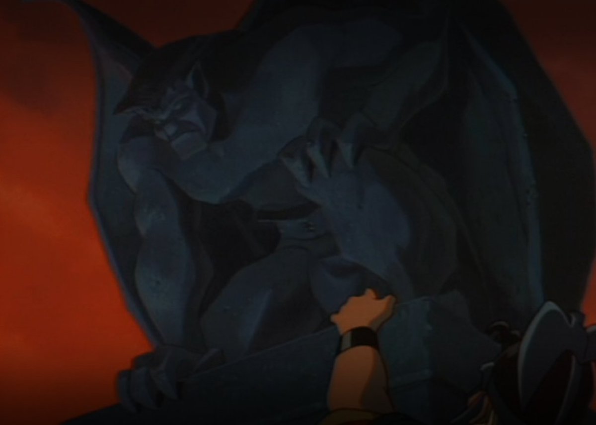 So then we get a dramatic sequence of the attackers using hooks and ropes to scale the castle walls as the sun is setting, leading to... someone I recognize.*whispers and points at the screen* THAT'S GARGOYLES.