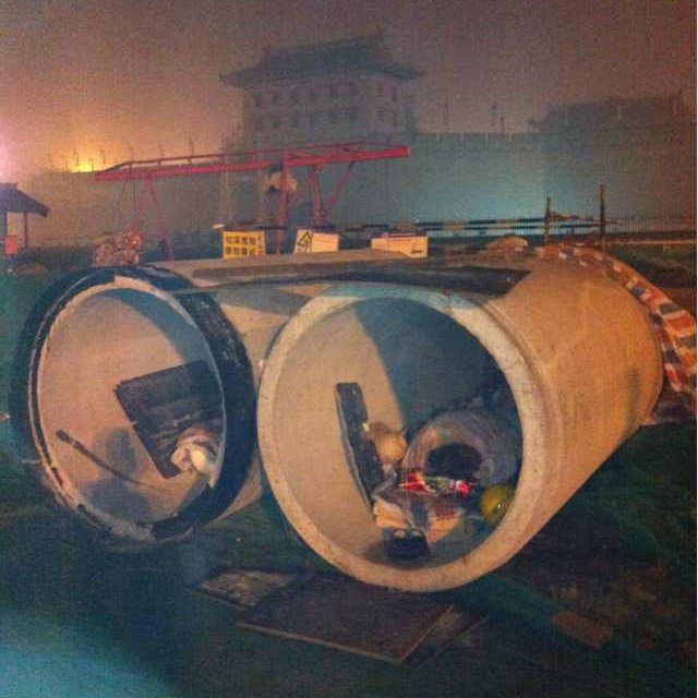 China pic, day 4:Migrant workers sleeping in the tunnels they're building outside the Xi'an city wall's south gate, 2013. I'd hitchhiked from Hangzhou to Xi'an and stayed w/ a friend for a month. Took this during a drunken night ramble around the city on my last night there.