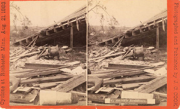 18. The destroyed C. Smith's residence is shown with the roof on the ground. In front of the collapsed building in a pile of rubble is a boot and a stove.