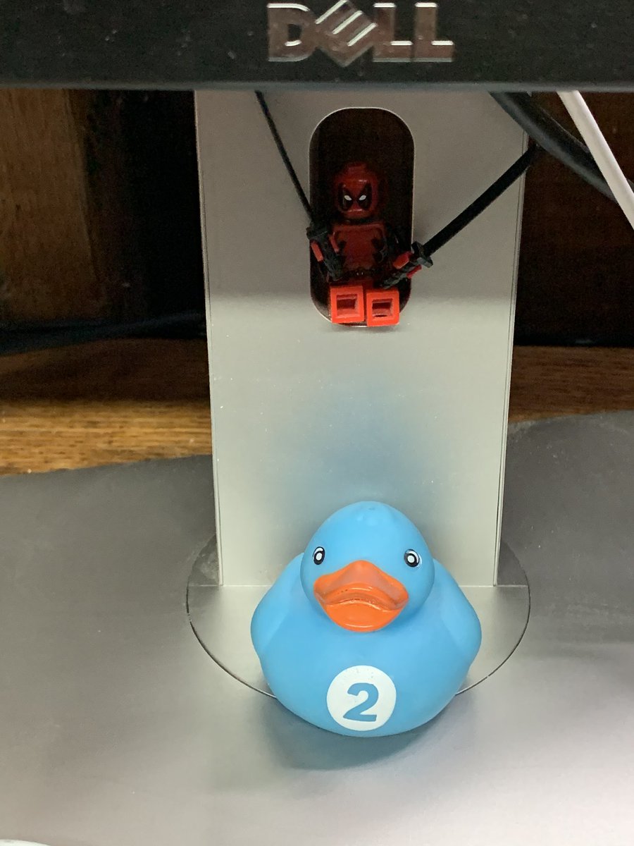 Rubber duck for debugging. Deadpool LEGO for cutting out features