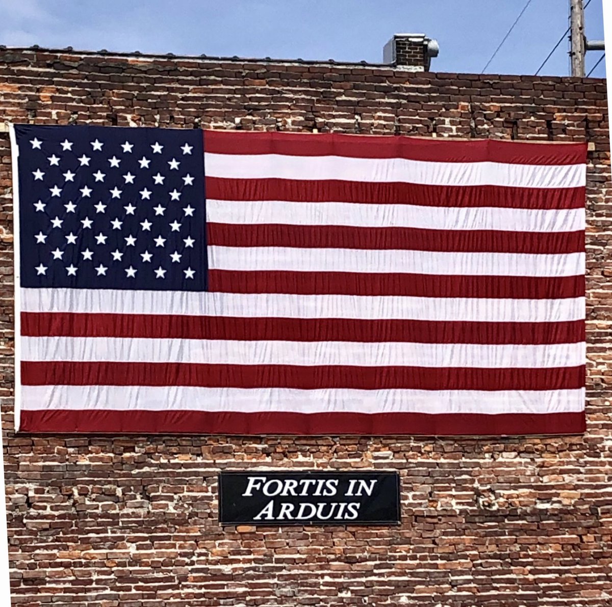 At <a href="/ullerysicecream/">Ullery's Ice Cream</a>, an anonymous person put up a flag and then this sign, “Fortis In Arduis” which is translated as “Strength in Adversity” or “Bravery in Difficulty.” Either way, we’re gonna get through this.
