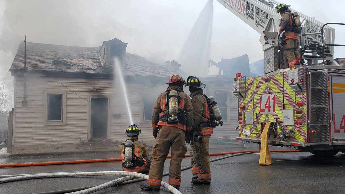 Working fire in two houses on Wilson Street east of Victoria Avenue North in Hamilton. Aerial and defensive operations. Multiple alarm assigned.  #HamOnt