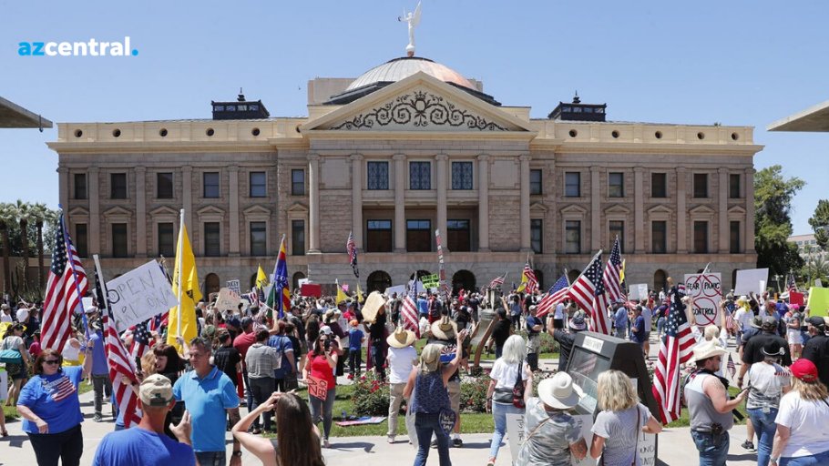 Hundreds gathered outside the Arizona State Capitol for a  #ReopenAZ protest, calling on Gov. Doug Ducey to end the stay-at-home order put in place to combat the coronavirus.  https://bit.ly/2xBeDVy Here's a glimpse of the protest, through the lens of  @photochowder (THREAD):