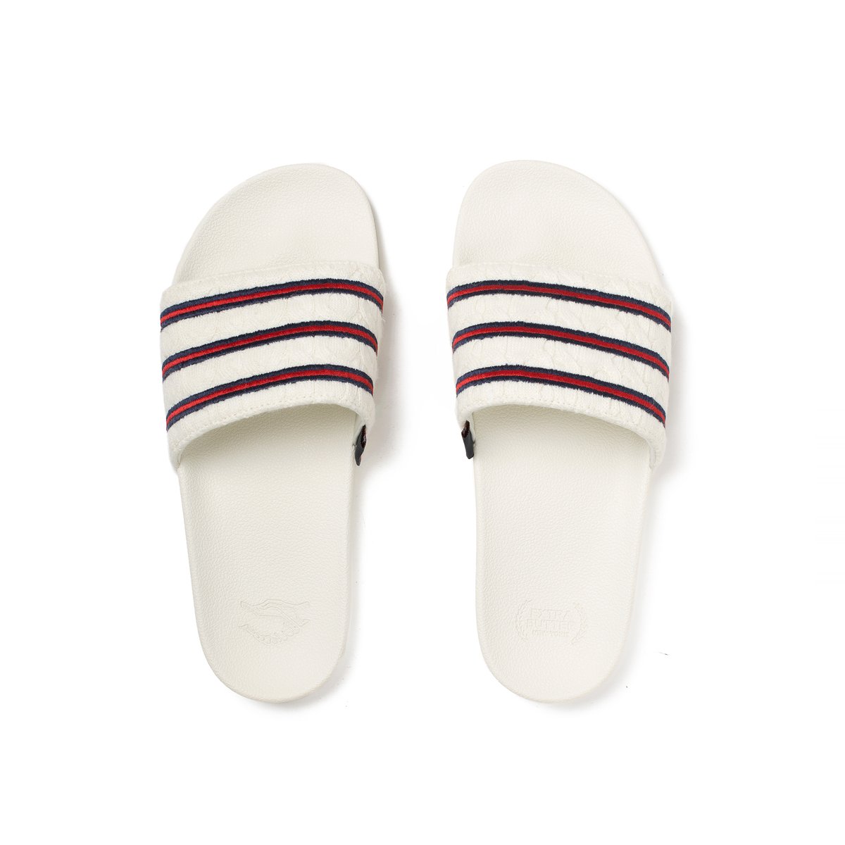 ExtraButter's tweet photo. Extra Butter x Adidas Consortium Cableknit Adilette Slides. Featuring the first ever cable knitted Primeknit, exclusively developed for EB, jacquard sewn collegiate striping and label, and embossed cobranding on heel cups. Releasing on https://t.co/pinhwr9Utu 4/21, at 11am EST https://t.co/vTmJo66m4F