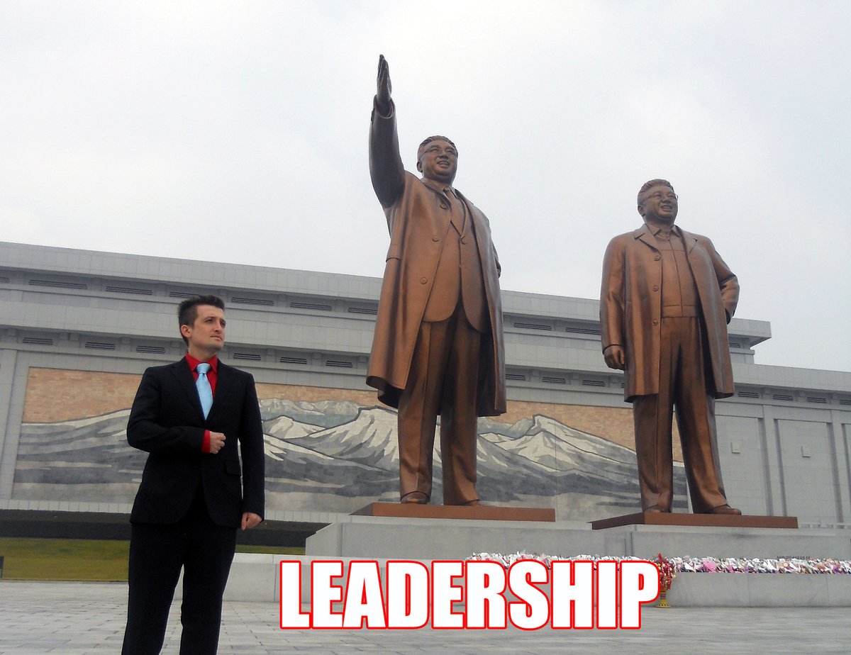 me in Pyongyang next to the giant statues of the leaders