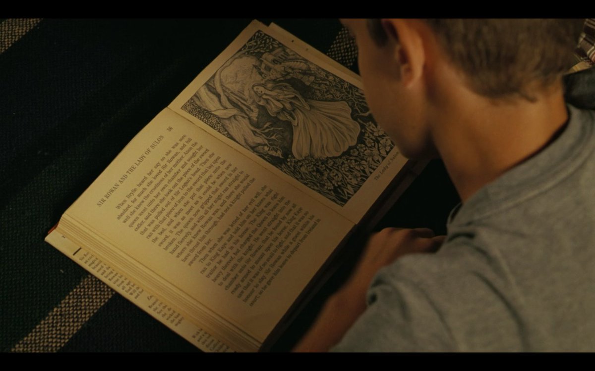 next is a shot of him reading this book titled "Sir Rowan and the Lady of Sulon". The interesting thing about this is that this book does not exist (which makes the inclusion of the name Sir Logan... hmm) but a search of the title wields a theory connecting it to a real one