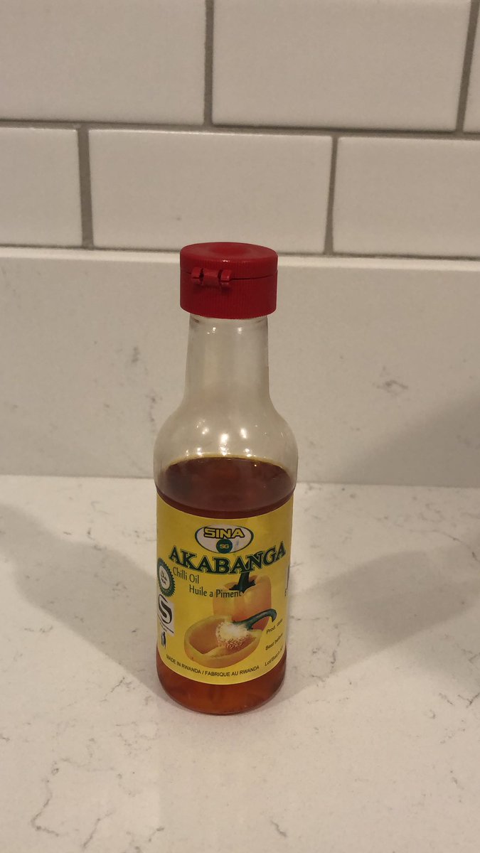 I have a problem with hot sauce. This one specifically is one of the hottest of my collection.  #akabanga from Rwanda, which I made sure to purchase in Brussels this past holiday. It comes out in drops. Today I had some drops on flatbread... My lips hurt.