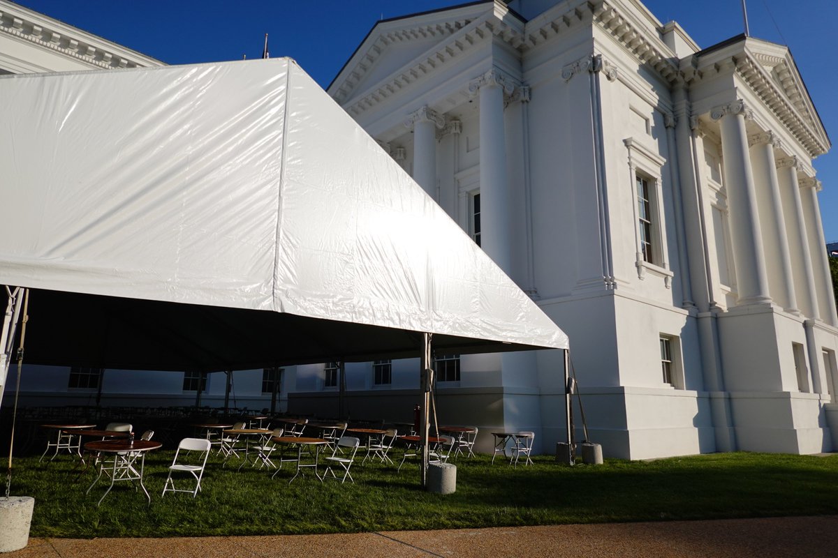 nedoliver's tweet photo. Here's the tent outside the capitol where the house of delegates will meet tomorrow. Looks kinda like someone is planning a super weird wedding party. https://t.co/FatYULXVfc