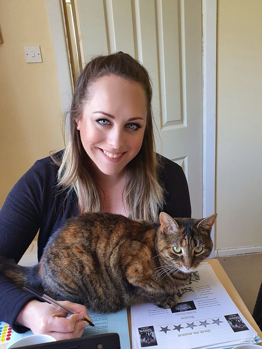 DramaBaron's tweet photo. Miss Baron's 'feline' good as she's employed a new member of @PHSNewbury called Cleo to help her mark all your Shrek Reviews. Not sure this furry friend has got the hang of social distancing yet... #WorkingFromHomeLife #CatColleagues #CatsOfTheQuarantine https://t.co/OpSHaGw284