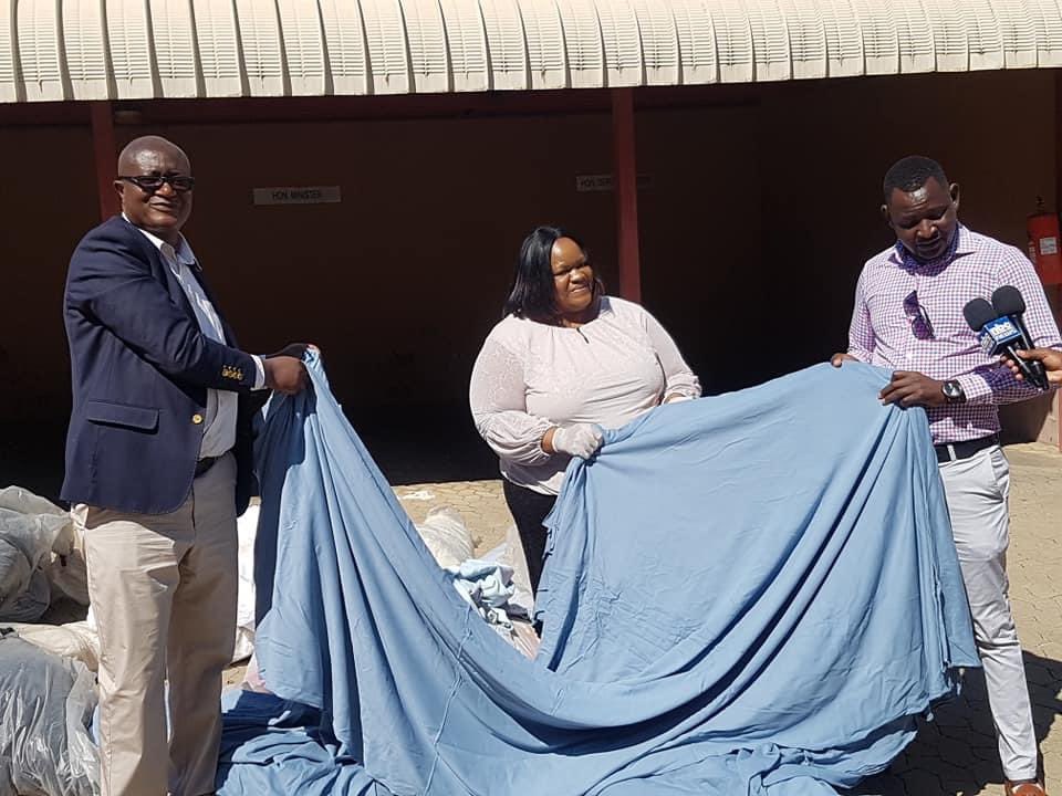 MinistryofIT's tweet photo. Hon. Minister Lucia Iipumbu of @MinistryofIT handed over textile material today to identified tailors in the Khomas Region to start producing public face masks. Following the COVID-19 outbreak, the Namibian government decided to implement some protective measures to prevent the https://t.co/qbGzUyHtr6
