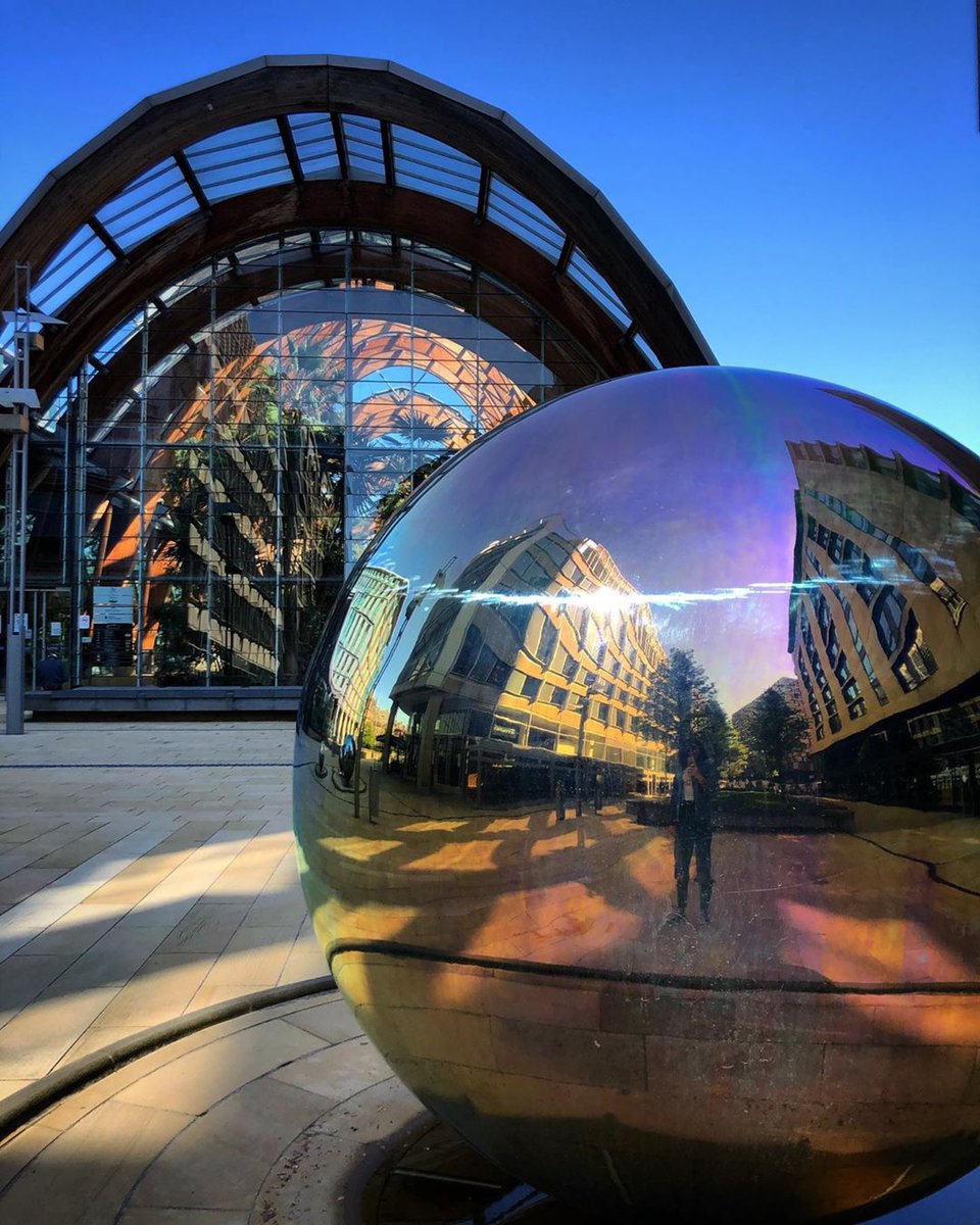 VisitSheffield's tweet image. With everything all quiet in @sheffcitycentre, an absence of water has resulted in an iridescent effect you wouldn’t normally see so vividly on the steel ball water sculptures in the Peace Gardens/Millennium Square. Looks especially colourful on a bright sunny blue-sky day.🔮😍👌