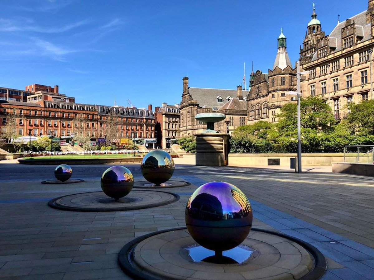VisitSheffield's tweet image. With everything all quiet in @sheffcitycentre, an absence of water has resulted in an iridescent effect you wouldn’t normally see so vividly on the steel ball water sculptures in the Peace Gardens/Millennium Square. Looks especially colourful on a bright sunny blue-sky day.🔮😍👌