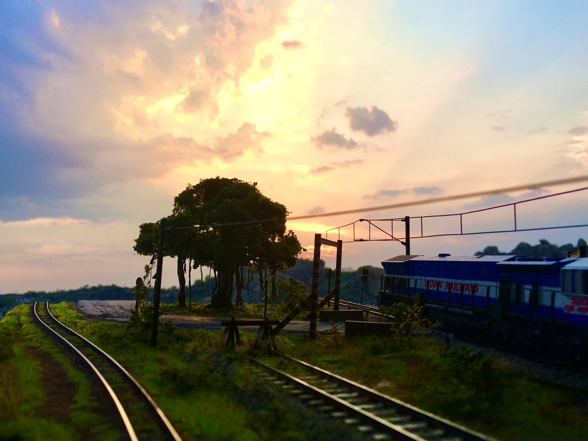 TDioramas's tweet photo. In days like these, what else can be more liberating than a sunset like that! #ModelTrains #ScaleModel #IndianRailways #WDP4 https://t.co/nbgSL94hiE