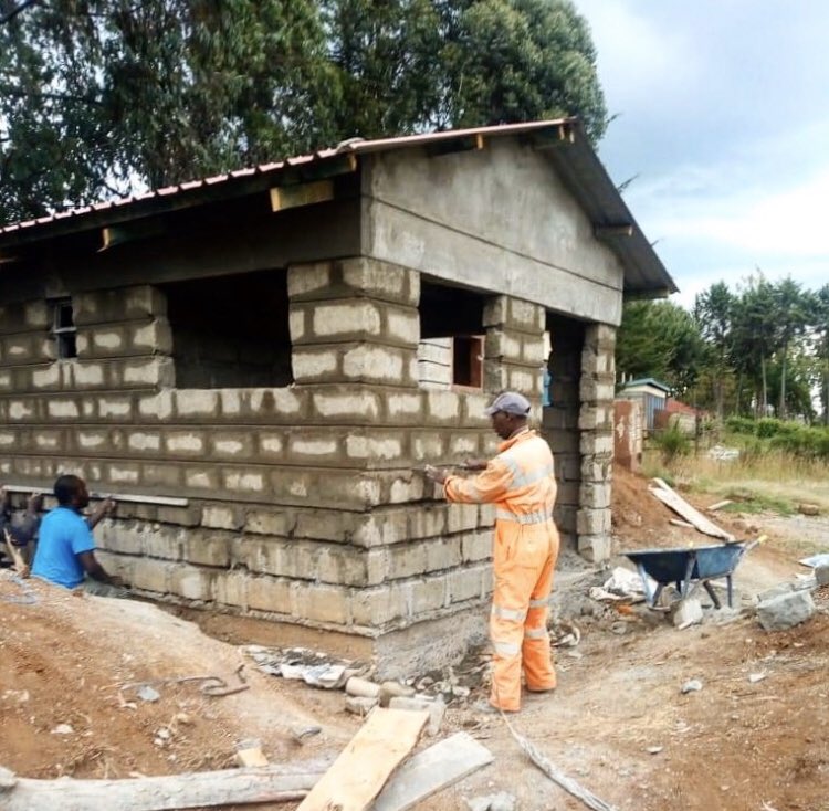 The latrine project at Chaka Reli Primary School is in its final stages.  The workers are pointing the exterior mortar lines of the bricks and parging the surface to give the bricks a smoother appearance. The project should be completed early next week. #kenya #school #latrine