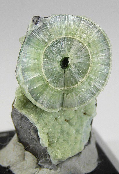  @Mute_Creed Wavellite, is a phosphate mineral. Distinct crystals are rare, and it normally occurs as translucent green radial or spherical clusters.