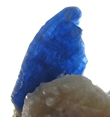  @Sckryle Afghanite, It forms blue to colorless, typically massive crystals in the trigonal crystal system. It fluoresces a bright orange.