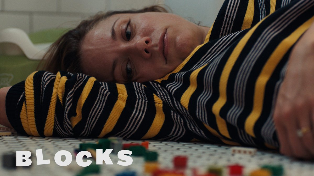 Blocks (short): An existential comedy about the mother of two young children struggling with parenting, until one day when she spontaneously begins to vomit toy blocks. Director: Bridget Moloney