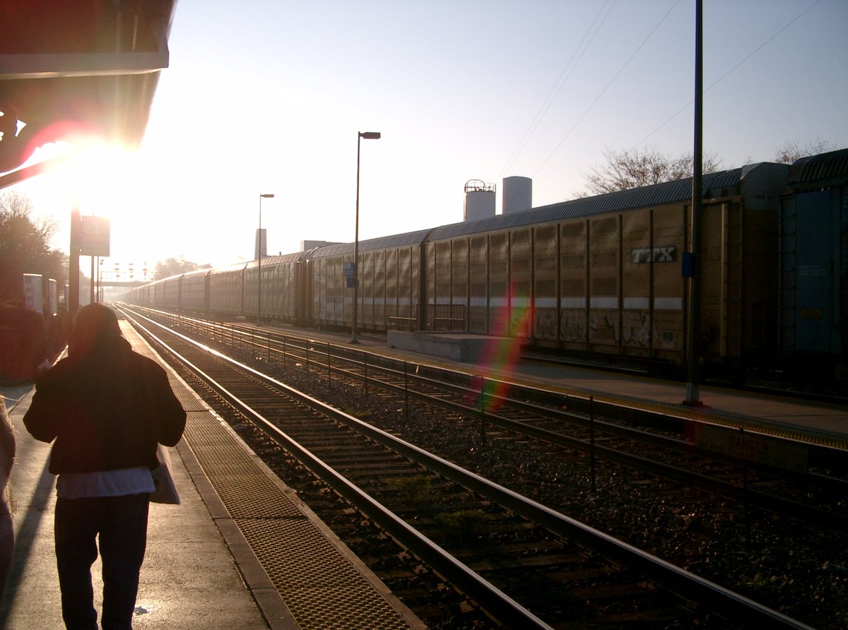 WeGoHistory's tweet image. Today is #MuseumSunshine and #TrainsTuesday so of course we have to share this glorious image of the sun shinning on a passenger waiting at the West Chicago Metra Station and a passing freight train. 

#localhistory #WestChicago #MuseumFromHome