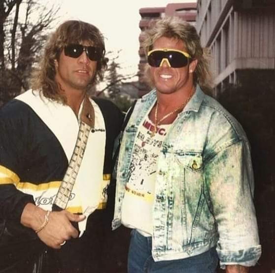 We'll start off with the Ultimate Hellwig. A cracking stonewash denim jacket with the tanktop that I imagine is either a hair metal band or a gym he's promoting. The sunglasses complete the look, since it covers the part of the face which he tends to paint. 5 star mullet, too.