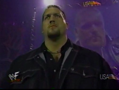 Big Show went through a few different outfits in early 2000 in an effort to look less like a big fat goth. This was the one I picked because he looks like he was entering Big Brother on launch night."Hi I'm Paul. I had trials with Arsenal and I would have sex in the house!"