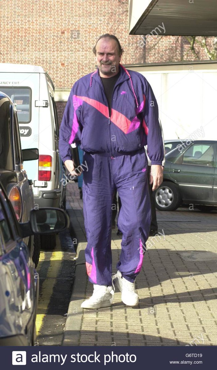 Jake Roberts UK outfit. The scoungers tracksuit. He's actually on his way to court for animal cruelty in this photo. He'd run off with his "managers" pension book in the next couple of hours. A great man, and quite a dresser.