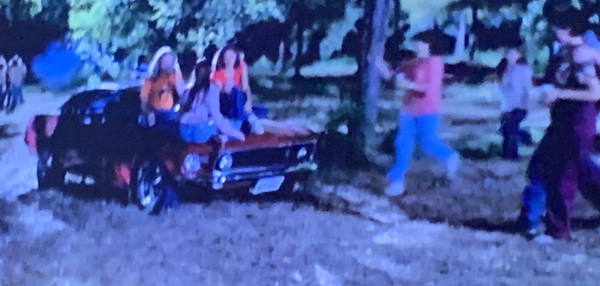 The Moon Tower scene has a few boy seen in earlier parts of the movie like this 69 Mustang. Does anyone else cringe when you see people sitting on the hood of a car? Even though old American iron could take it, it still drives me crazy.  #PartyAtTheMoonTower