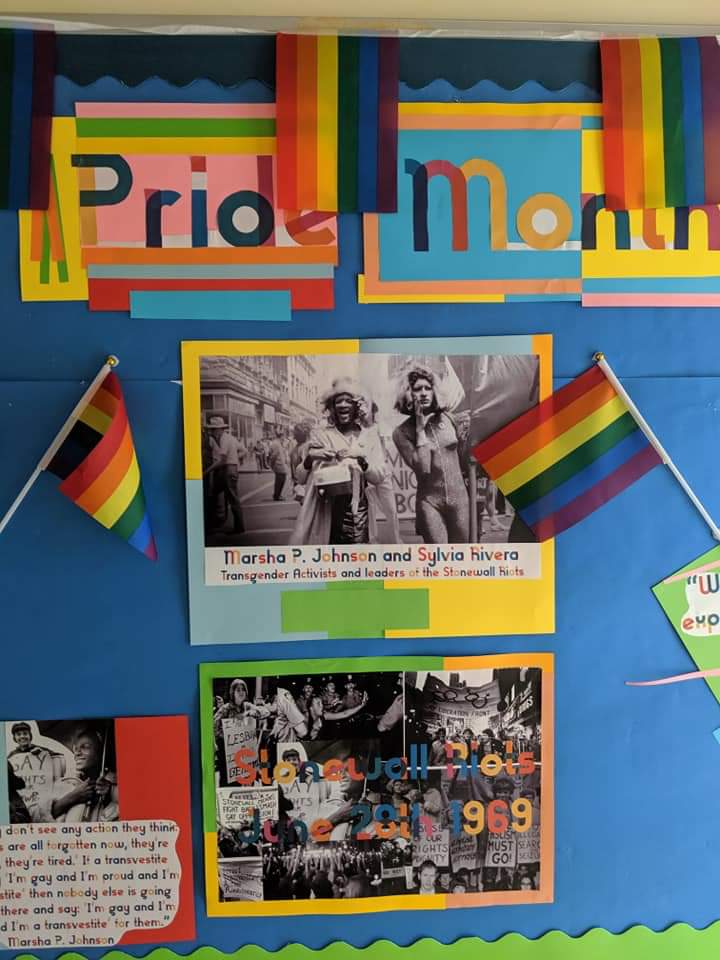 Teacher_Cameron's tweet photo. Some pictures of the Pride Month display I did at my school last year. 

I'm the LGBTQ+ &amp; Equalities Officer there, and we get plenty of LGBTQ+ young people come through our doors. I think being openly Gay gives them a lifeline, someone who will listen and support them. https://t.co/9jbxZsOeiH