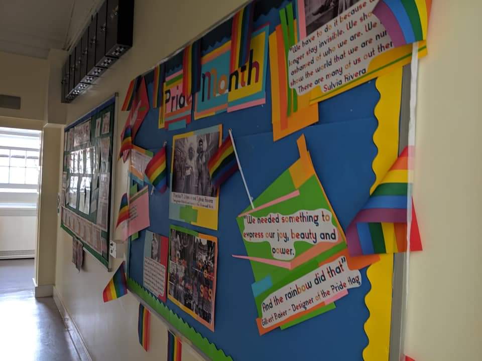 Teacher_Cameron's tweet photo. Some pictures of the Pride Month display I did at my school last year. 

I'm the LGBTQ+ &amp; Equalities Officer there, and we get plenty of LGBTQ+ young people come through our doors. I think being openly Gay gives them a lifeline, someone who will listen and support them. https://t.co/9jbxZsOeiH