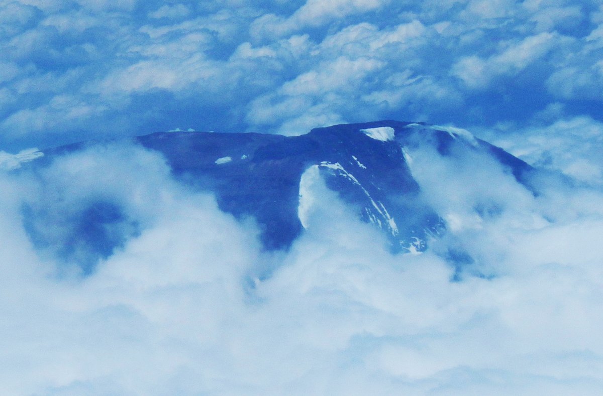 10/ A day-time flight. Which means at one point you can look outside your airplane window and see the peak of Mt. Kilimanjaro as we fly over. Or it could be Mt. Meru. Why worry? It's one of the two. My photo: