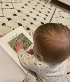 What do I think is beautiful?  Baby girl reading a book and touching the picture of her JJ! #thinker #perspective