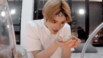 Taeyong the baby, holding a baby chick
