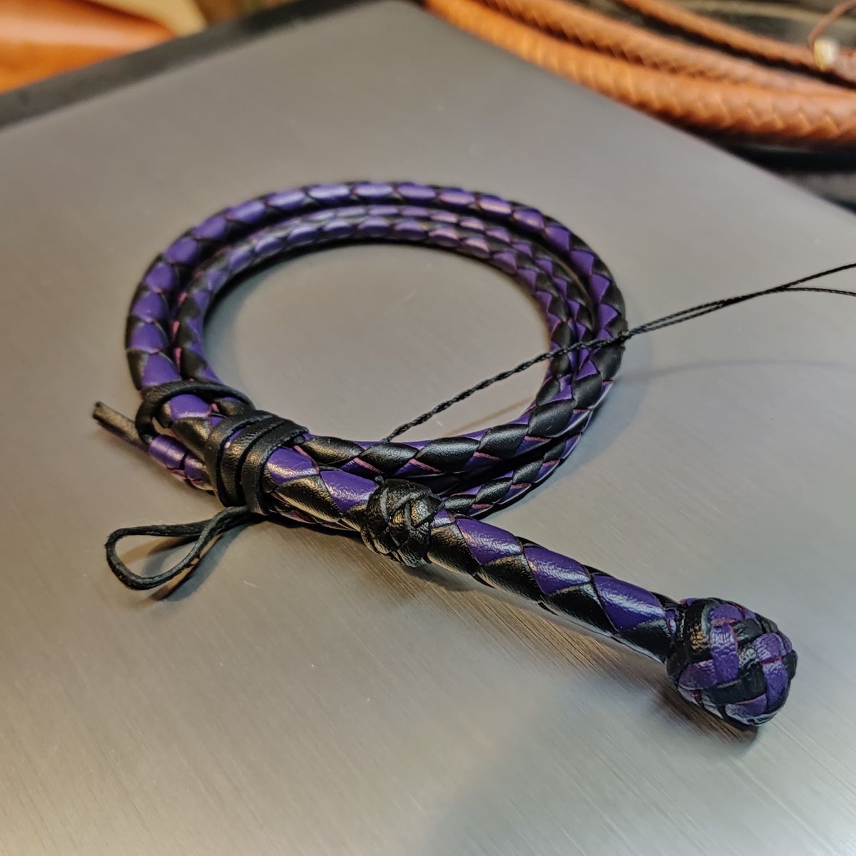 A Little Bull Snapper in black and purple. The great thing about Little Snappers is that they crack just like full size whips, great for practicing at home and transferring those skills when you have more room to practice!