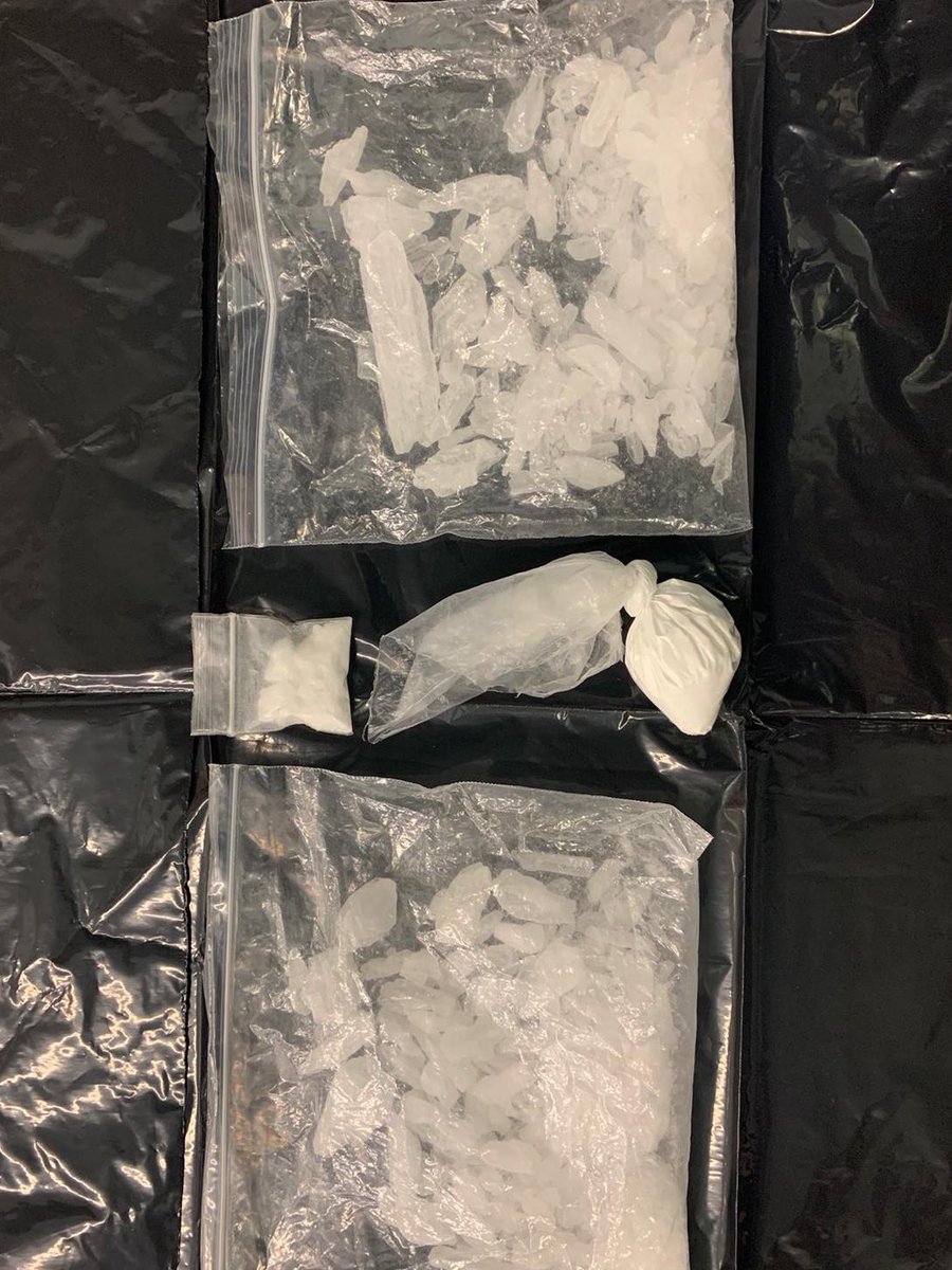 MJPolice's tweet photo. Before COVID-19, “Meth” was our police service’s top health and safety concern. We’ve changed how we operate now, but we’re still taking “meth and coke” off the street- 13K worth. The people arrested will be #physicaldistancing from the public in our cells until court tomorrow. https://t.co/S0kkW3L6Op