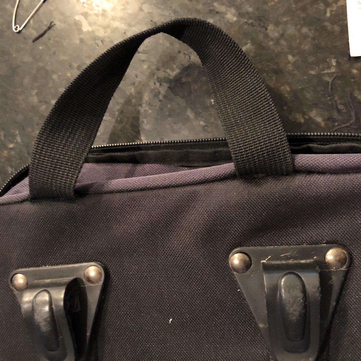 Underside view of fix. It is not factory-certified, this is an 8-year old bag that has seen heavy use. I just need it for neighborhood and light (i.e., S24O) touring.