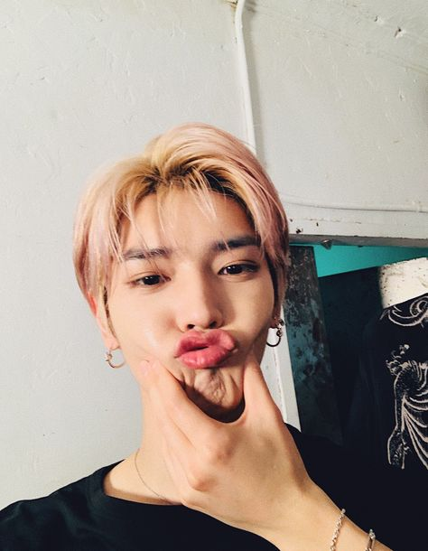 Taeyong the baby, being squeezed into a duck face