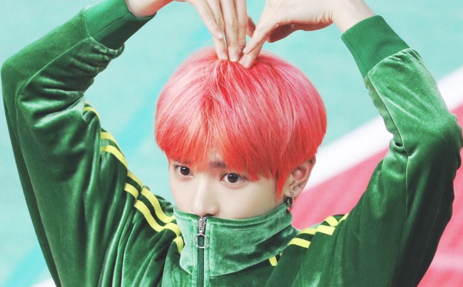 Taeyong the baby, hiding in his green track suit