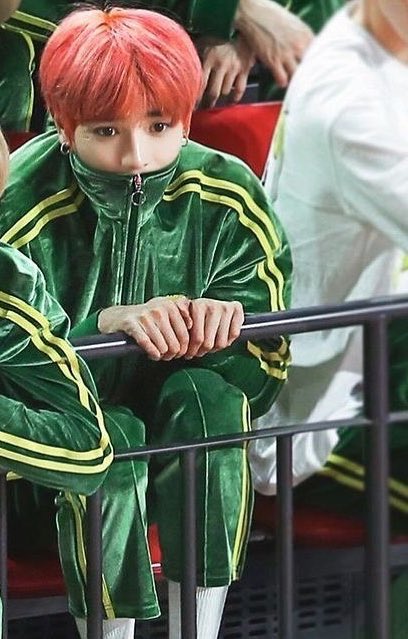 Taeyong the baby, hiding in his green track suit