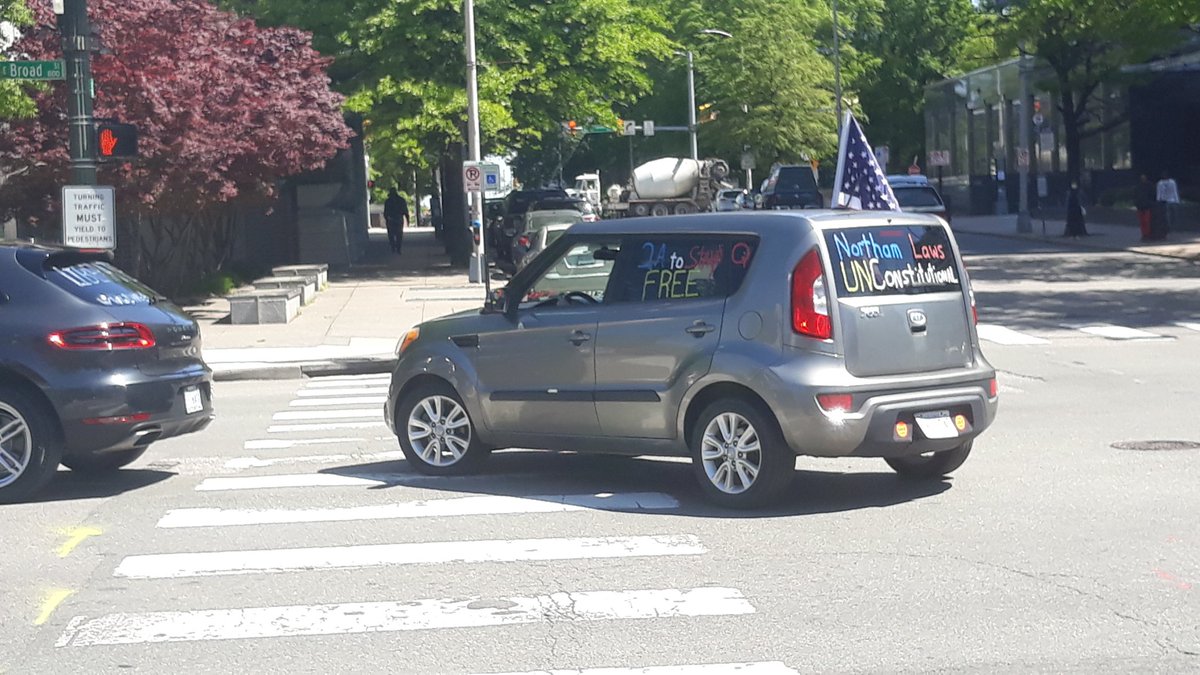 Pair of cars with Qanon references